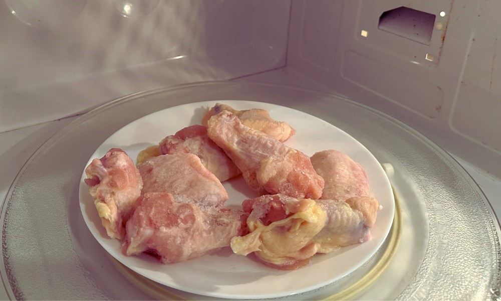 Defrosting a whole chicken vs. chicken pieces in the microwave