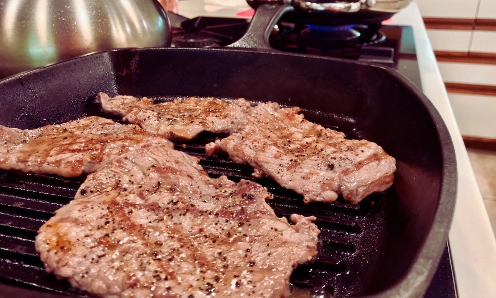 flat iron steak on cast iron pan