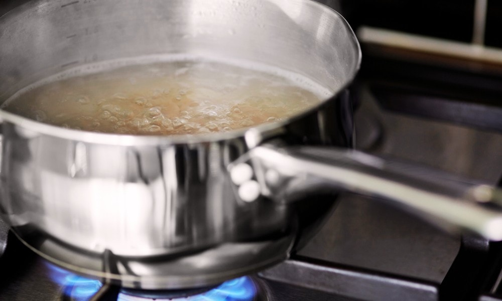 Add Vinegar and Water to Deep Clean Stainless Steel Pans
