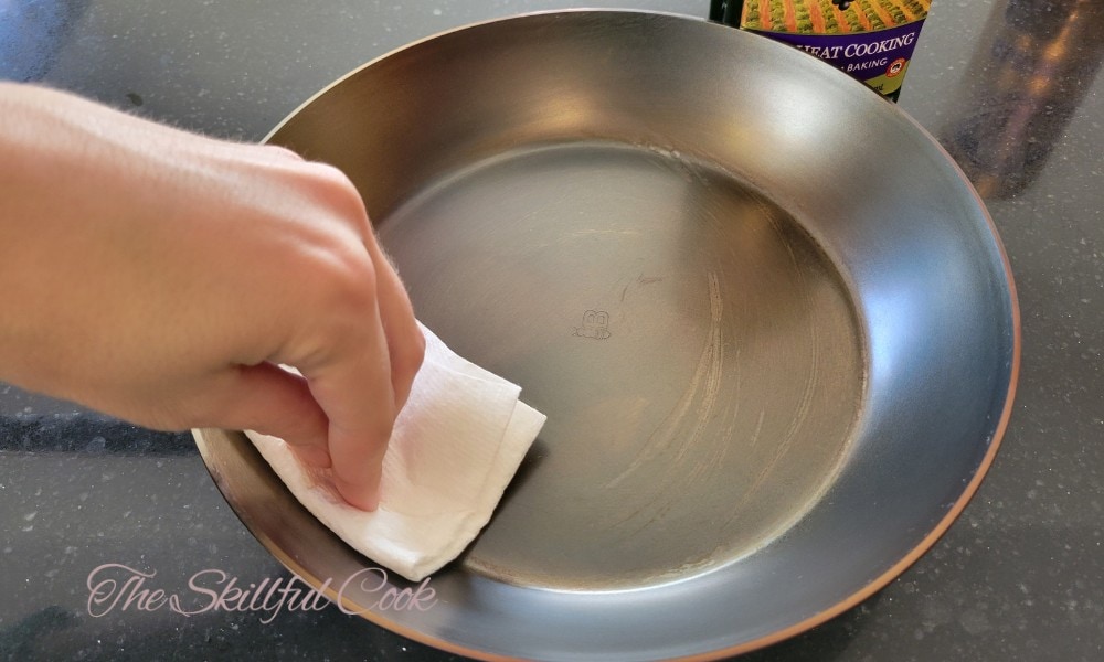 https://theskillfulcook.com/wp-content/uploads/2023/11/Apply-Oil-Sparingly-on-your-carbon-steel-pan.jpg