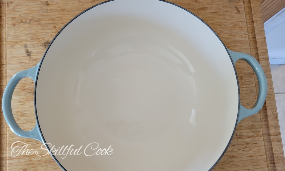 How to Remove Stains from Enamel Cast Iron Pans - Drain and Scrub