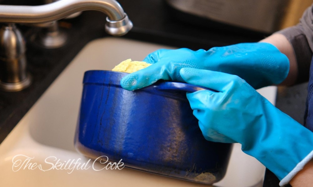 how to clean enameled cast iron - Start by cleaning with a soft sponge