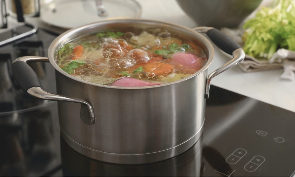 Stainless steel Dutch oven with soup