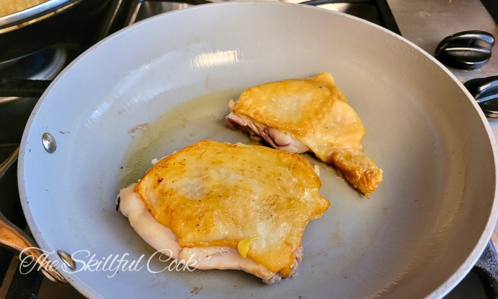 Cooking chicken meat on a Caraway cookware